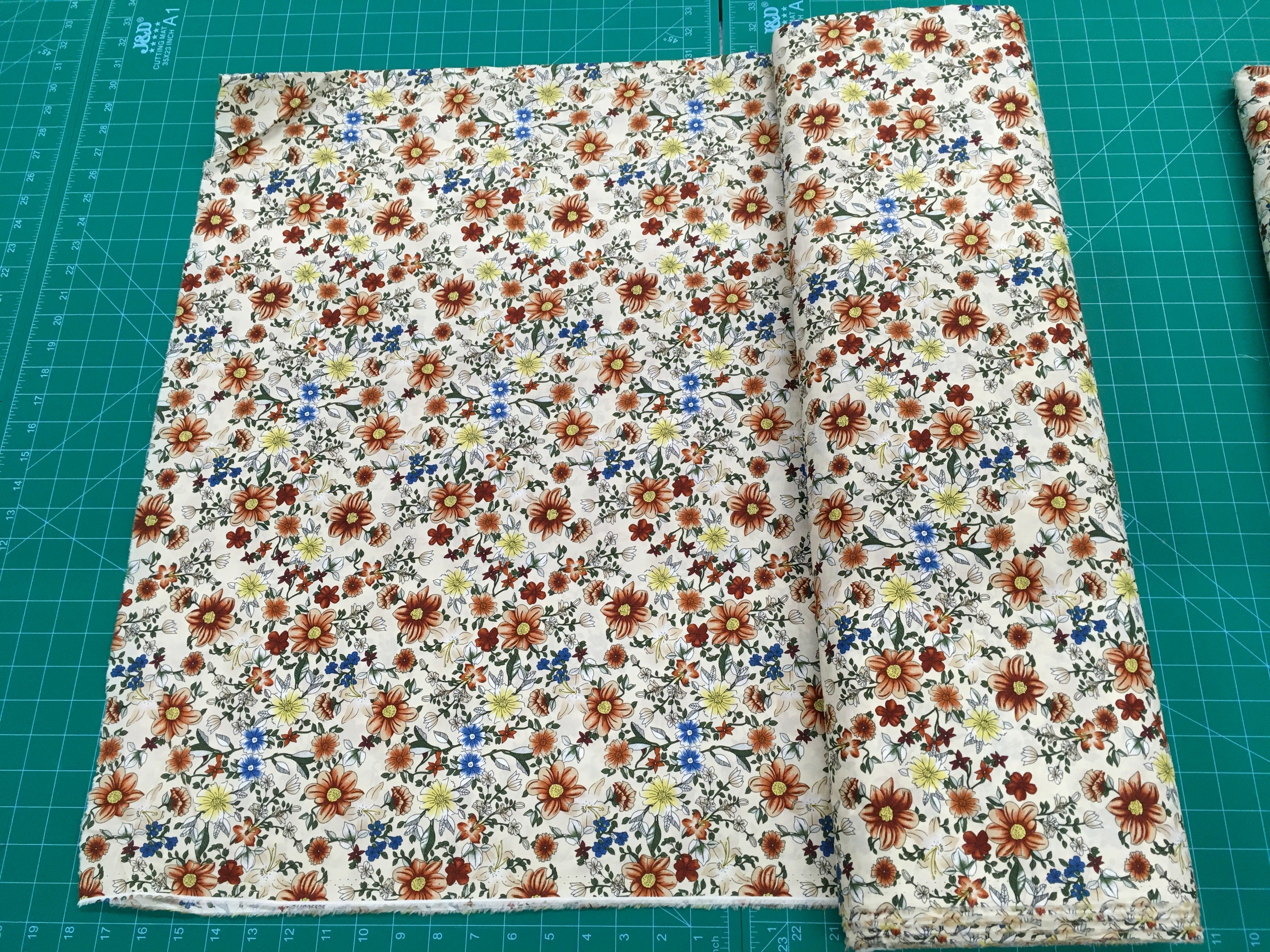 Brown and Blue Flowers Tan Background 56 inch Cotton Fabric